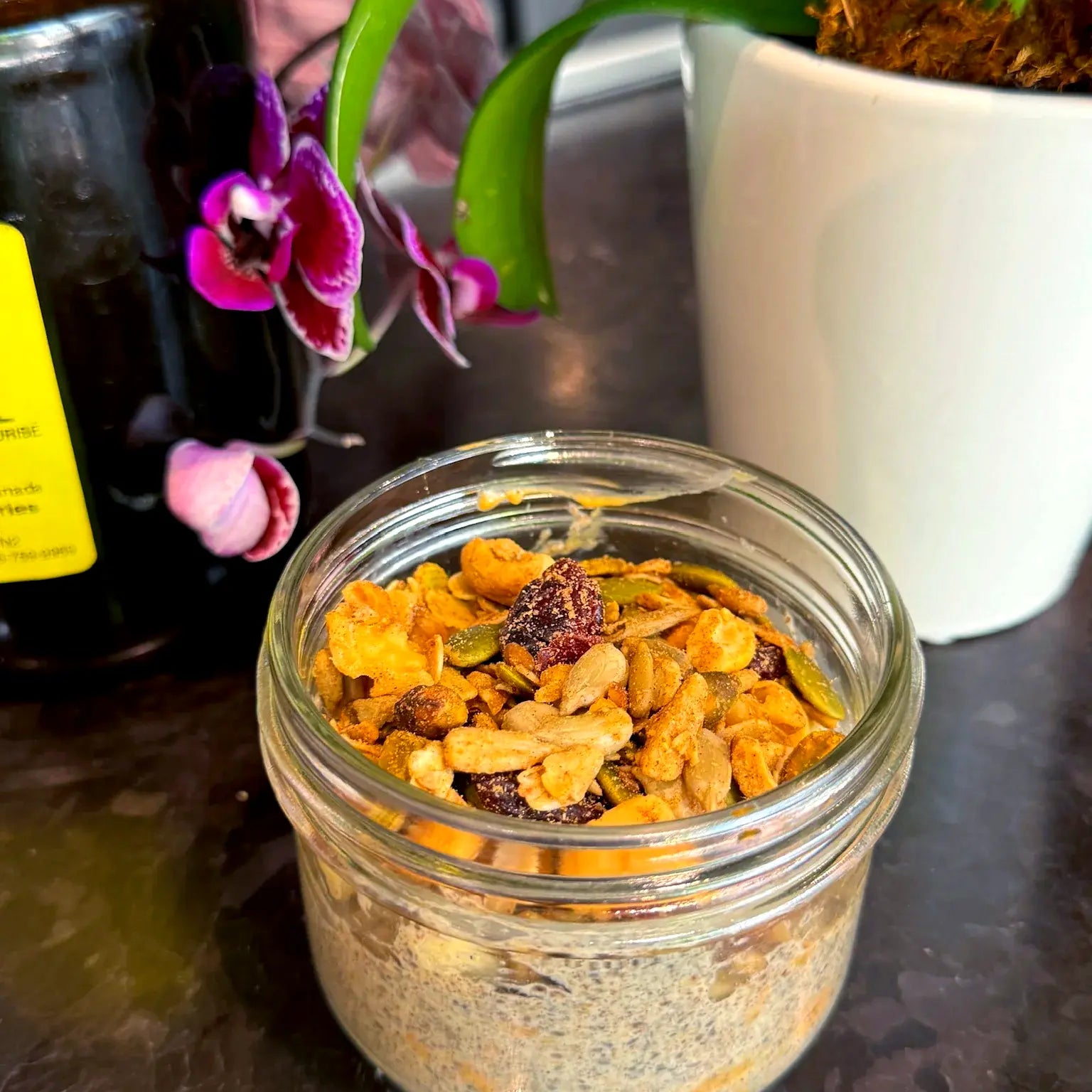 Small jar of creamy overnight oats with a crunchy topping