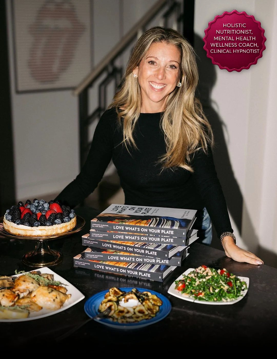 Stephanie Valentine with a stack of her cookbook Love What's On Your Plate and dishes from it